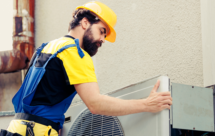 Technicians inspecting ventilation system